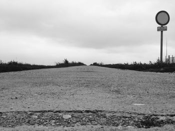 View of road against cloudy sky