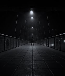 Man in illuminated tunnel