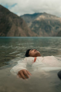  view of man  swimming in lake.