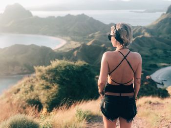 Rear view of man looking at mountains