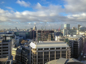 High angle view of buildings in city against sky