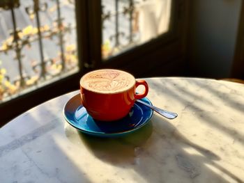 High angle view of coffee cup on table