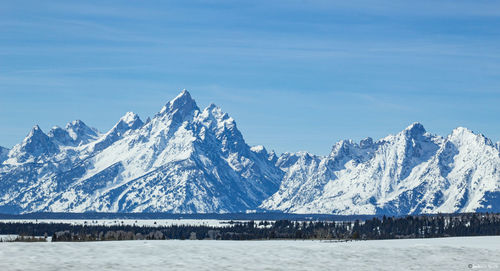 Scenic view of snowcapped mountains against sky