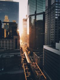 Cityscape against sky at sunset