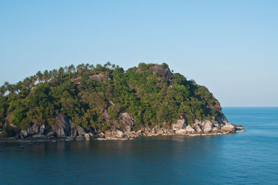 Scenic view of sea against clear blue sky