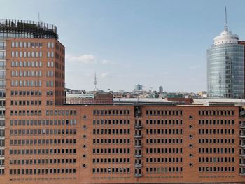 Buildings in city against sky