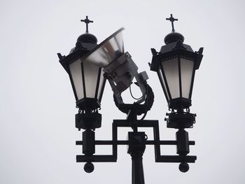 Low angle view of street light against sky