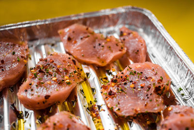 Marinated meat chunks in oil pepper and chili flakes