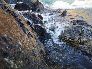 High angle view of rock formation in sea