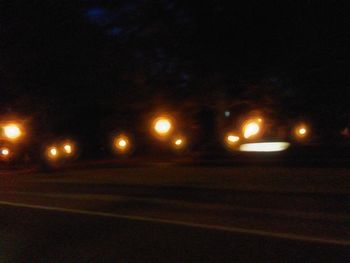 Illuminated street lights at night