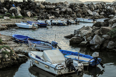 Boats moored on sea shore