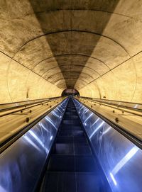 Low angle view of illuminated tunnel