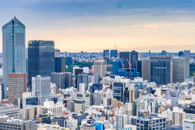 Modern buildings in city against sky