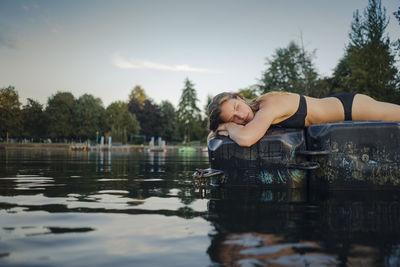Young woman lying on bathing platform