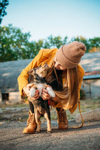 Woman with dog outdoors