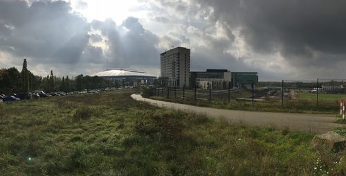 Panoramic view of land and buildings against sky