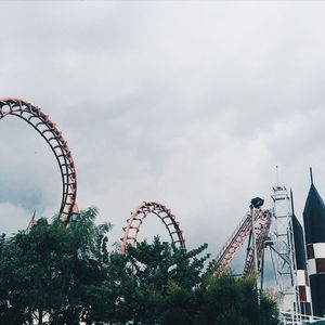 Low angle view of ferris wheel against sky