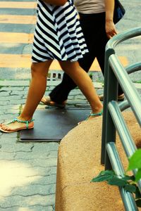 Low section of woman standing on steps