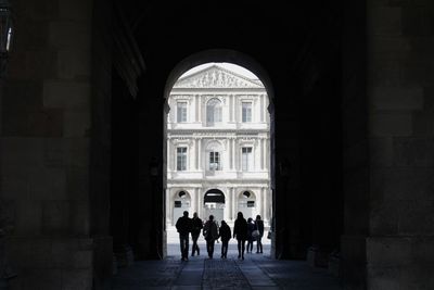 People walking in historical building