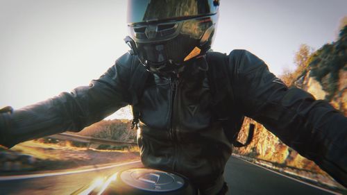 Man riding motorcycle on road