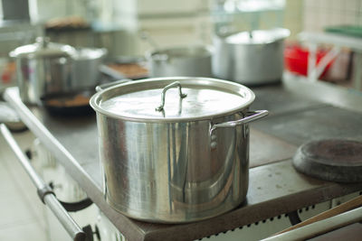 Large pot for cooking. kitchen utensils in the dining room. stainless steel water tank. 