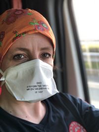 Close-up portrait of man wearing mask