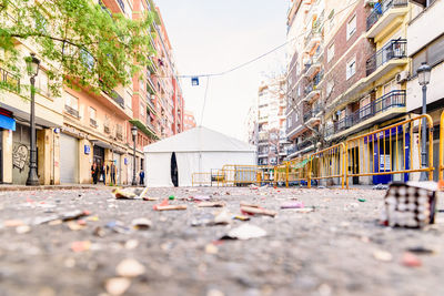 Surface level of alley amidst buildings in city