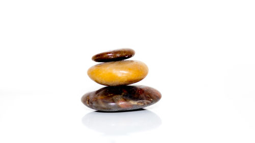 Close-up of fruit over white background