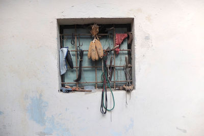 Clothes hanging on wall of building