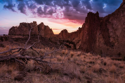 Scenic view of rocky mountains against sky during sunset