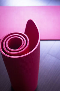 High angle view of exercise mats on floor at gym