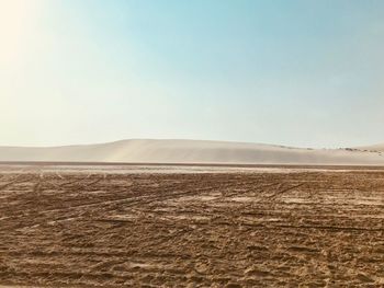 Scenic view of desert against clear sky