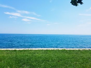 Scenic view of blue sea against sky