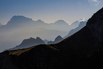 Scenic view of silhouette mountains against clear sky