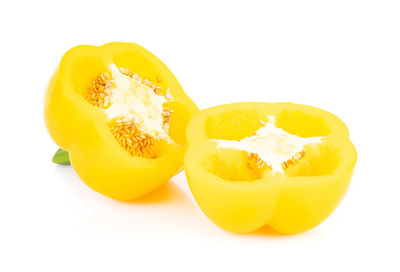 Close-up of orange fruit against white background