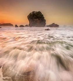 Scenic view of sea against sky during sunset