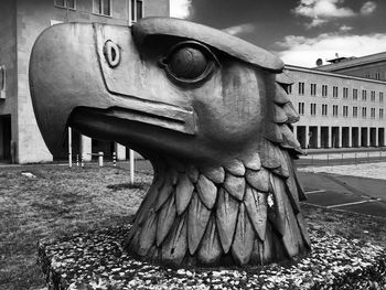 Statue of horse in front of building