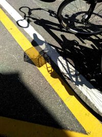 Close-up of yellow shadow on road