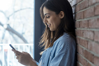 Young woman using mobile phone