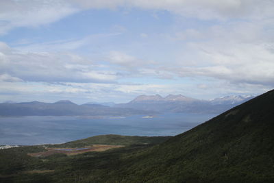 Scenic view of mountains against cloudy sky