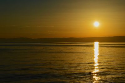 Scenic view of sea at sunset