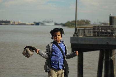 Portrait of boy standing at beach