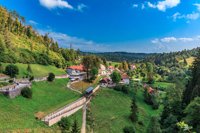 High angle view of trees and buildings against sky