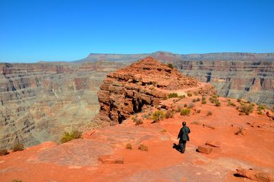 Rock formations in desert against clear blue sky