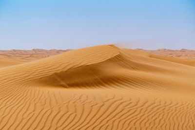 Scenic view of desert against clear sky