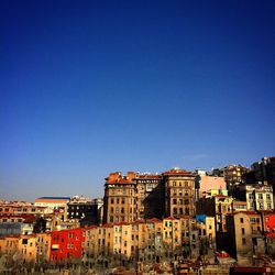 Buildings against blue sky and clouds