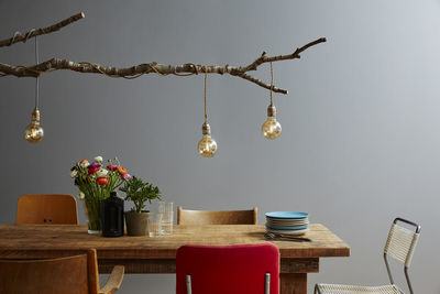 Electric lamp hanging on table