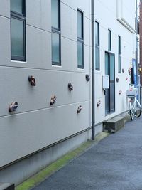 Cars on street by buildings in city