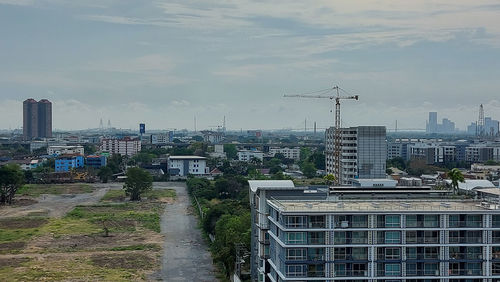 Buildings in city against sky