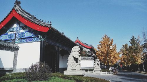 Statue in temple against clear sky